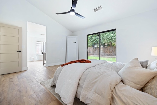 bedroom featuring ceiling fan, light hardwood / wood-style floors, multiple windows, and access to outside