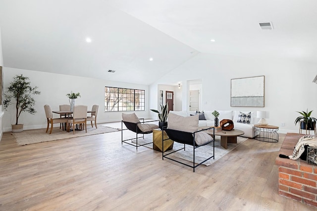 5017 W Locust Ave, Fresno, CA 93722 - living room featuring light wood finished floors and lofted ceiling
