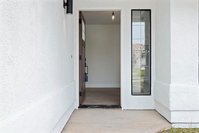 5017 W Locust Ave, Fresno, CA 93722 - doorway to property featuring stucco siding