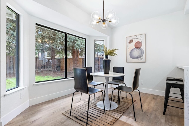 5017 W Locust Ave, Fresno, CA 93722 - dining space featuring a chandelier and wood finished floors