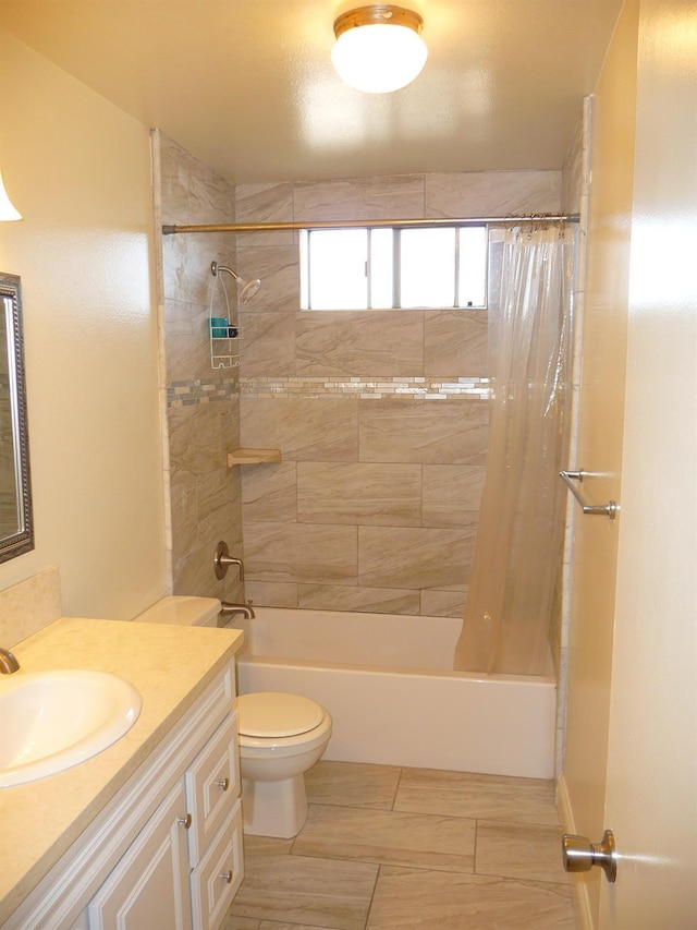 full bathroom featuring vanity, shower / bath combination with curtain, and toilet