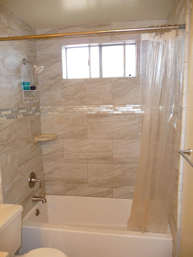 bathroom with shower / bath combination with curtain, plenty of natural light, and toilet