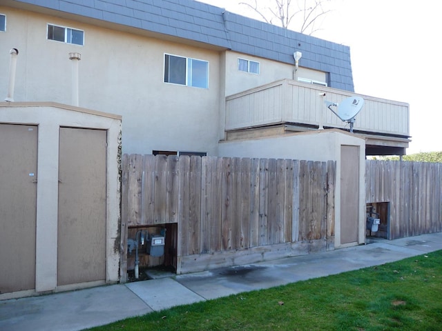 back of house with a balcony