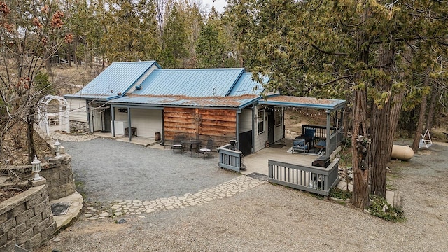 rear view of house featuring a patio