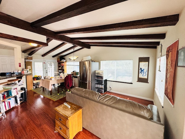 living room featuring dark hardwood / wood-style flooring and lofted ceiling with beams