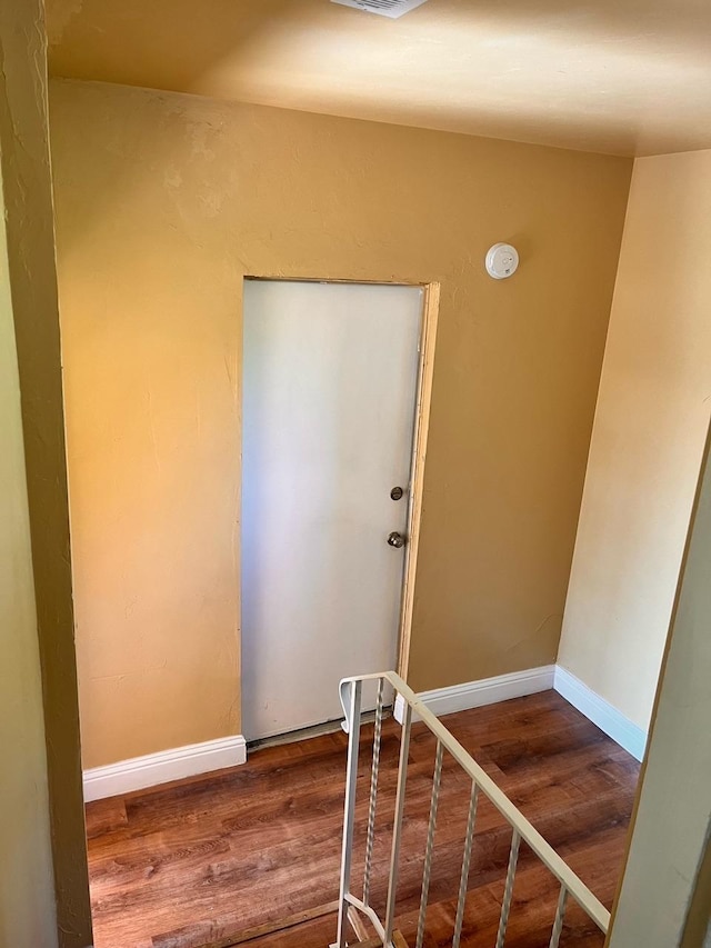 staircase featuring hardwood / wood-style floors