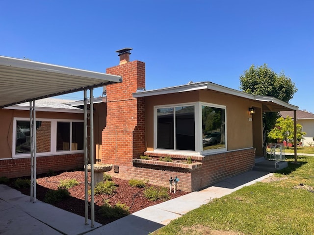 view of home's exterior with a yard