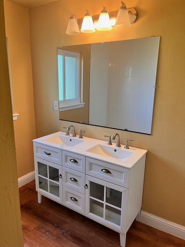 bathroom featuring hardwood / wood-style flooring and vanity