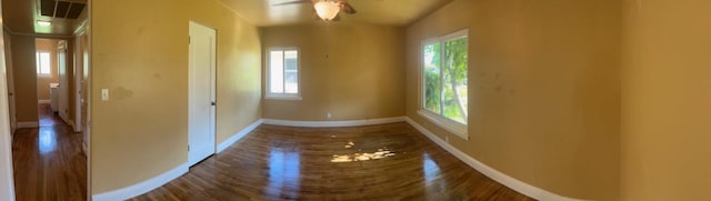 unfurnished room with hardwood / wood-style floors