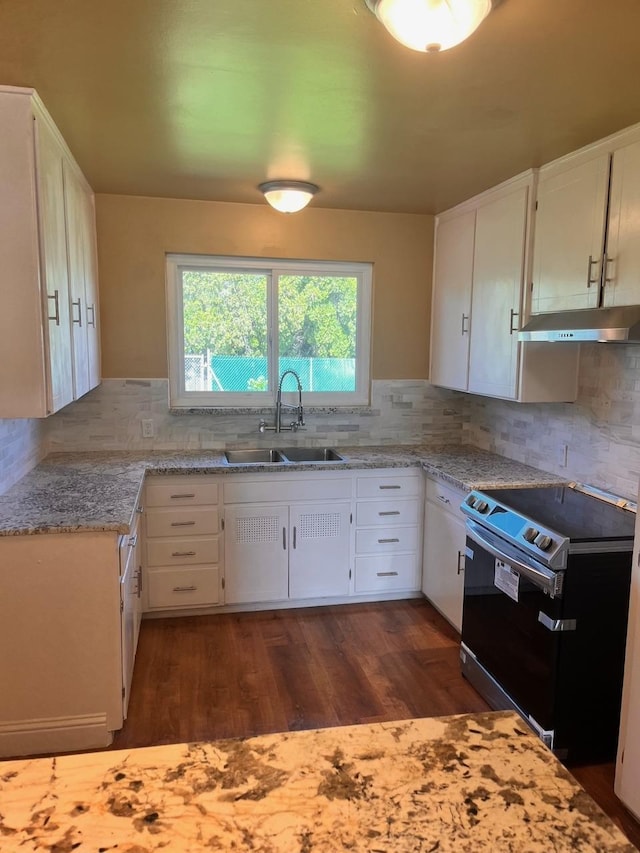 kitchen with white cabinetry, sink, electric range, and backsplash