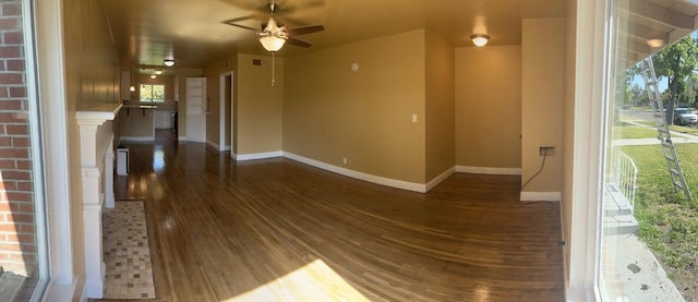 spare room featuring ceiling fan and dark hardwood / wood-style flooring