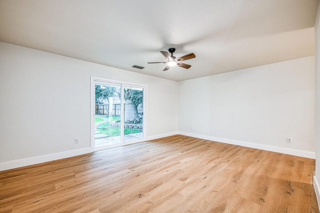 empty room with ceiling fan and light wood-type flooring