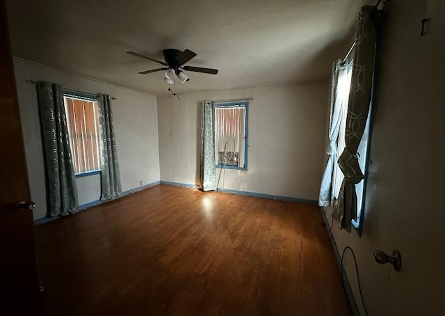 unfurnished room with hardwood / wood-style flooring and ceiling fan