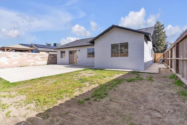 rear view of house featuring a patio