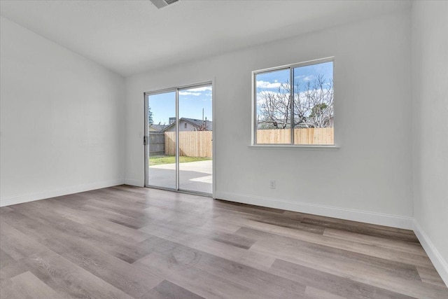 unfurnished room featuring light hardwood / wood-style flooring