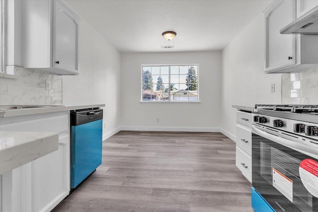 kitchen with white cabinetry, dishwasher, light hardwood / wood-style flooring, and stainless steel gas stove