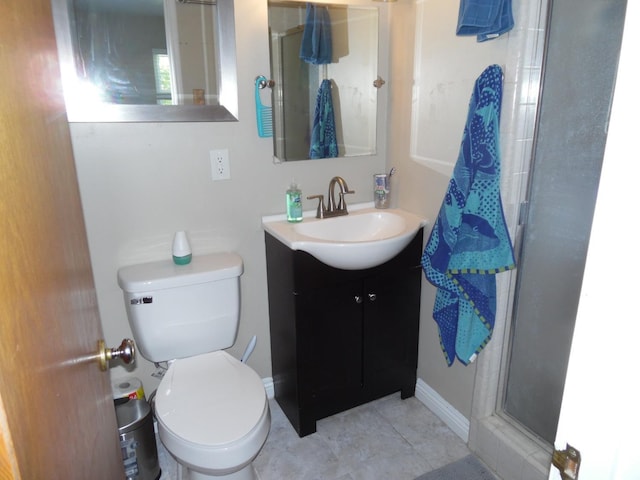 bathroom with vanity, toilet, an enclosed shower, and tile patterned flooring