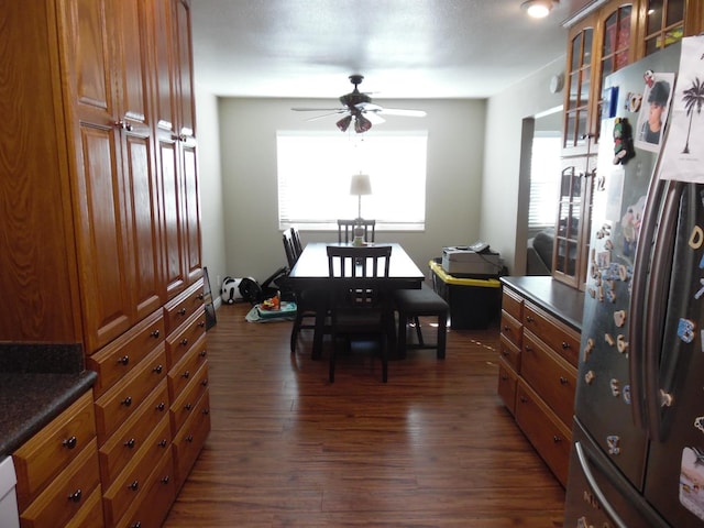 dining room featuring ceiling fan and dark hardwood / wood-style flooring