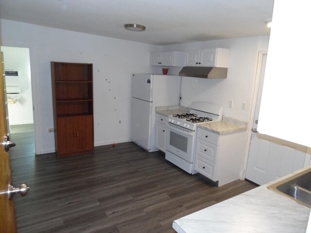 kitchen with white cabinetry, dark hardwood / wood-style flooring, and white appliances