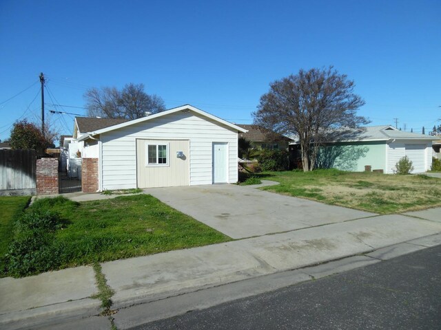 view of outbuilding featuring a lawn