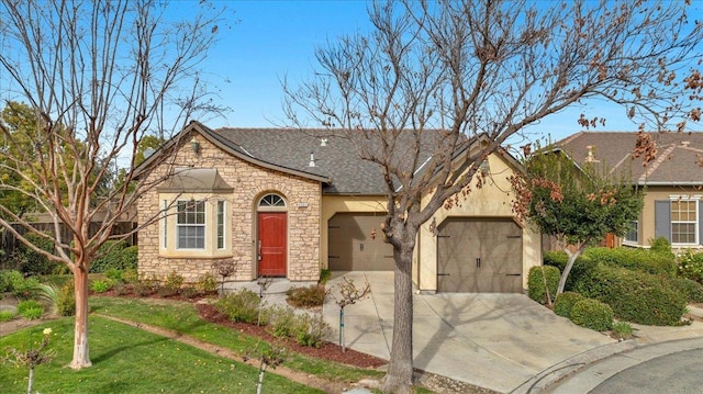 view of front of home featuring a garage and a front yard