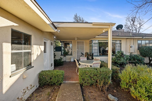 entrance to property featuring a patio