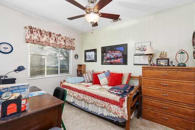 bedroom featuring light colored carpet and ceiling fan