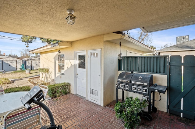 view of patio featuring a grill