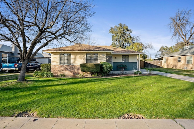 ranch-style house featuring a front lawn