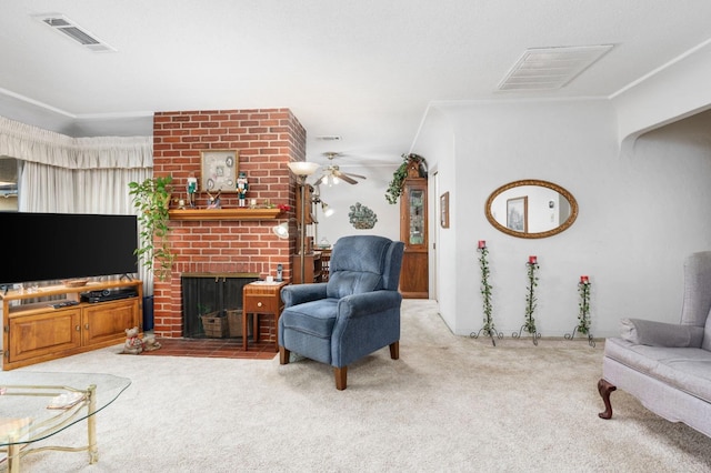 carpeted living room featuring a fireplace and ceiling fan