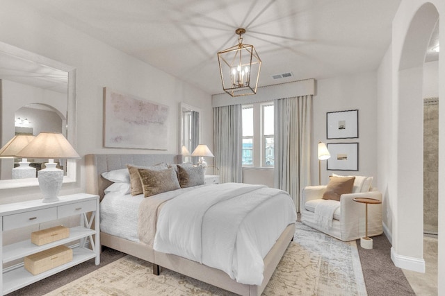 bedroom featuring a chandelier