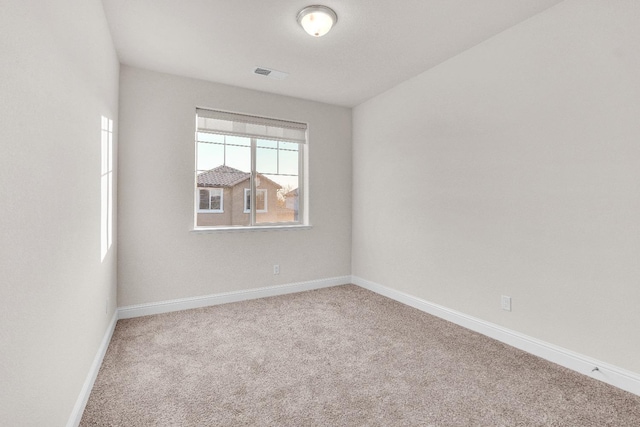 empty room with carpet flooring