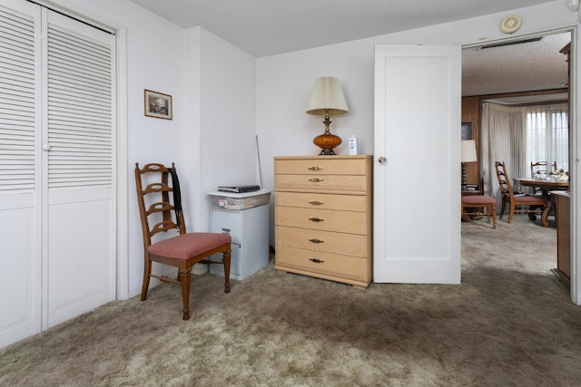 sitting room featuring carpet