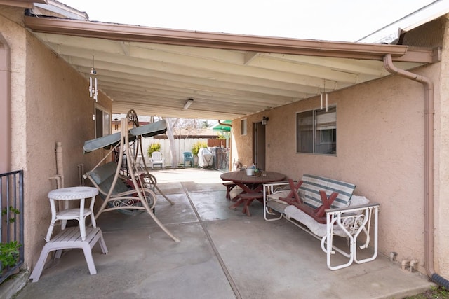 view of patio featuring fence