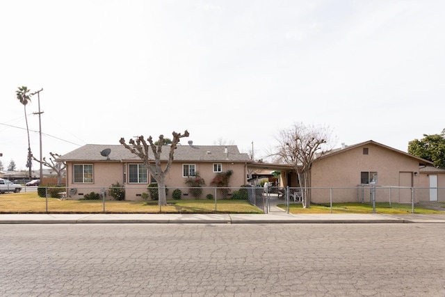 ranch-style house with a fenced front yard, a gate, and stucco siding