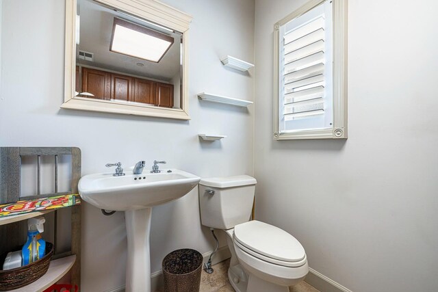 bathroom with sink and toilet