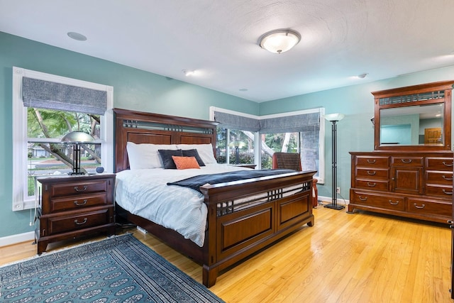 bedroom with light hardwood / wood-style flooring