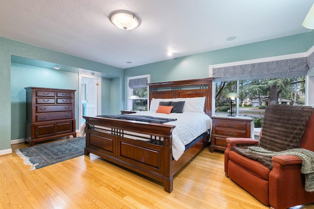 bedroom with light wood-type flooring