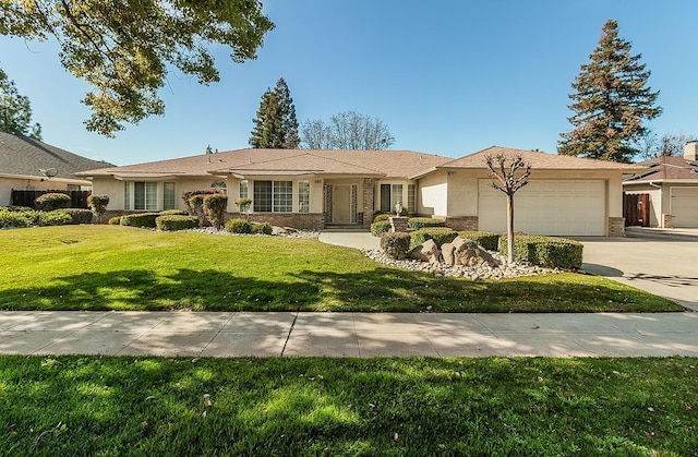 ranch-style house featuring a garage and a front yard