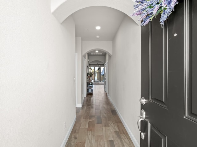 hall with dark hardwood / wood-style flooring