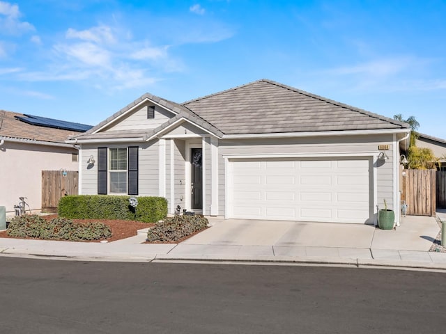 ranch-style home featuring a garage