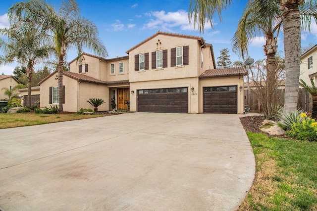 mediterranean / spanish home featuring a garage