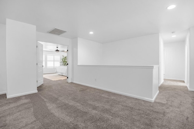 unfurnished room with recessed lighting, visible vents, and carpet flooring