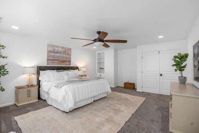 carpeted bedroom with recessed lighting, baseboards, and a closet