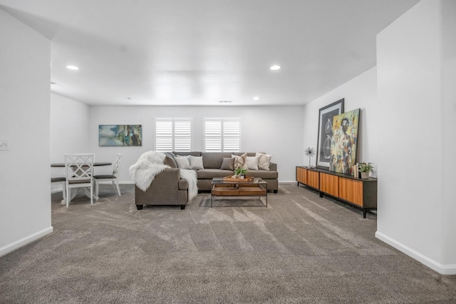 carpeted living room featuring recessed lighting and baseboards