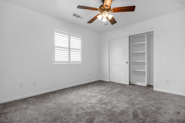 unfurnished bedroom featuring visible vents, a ceiling fan, a closet, carpet, and baseboards