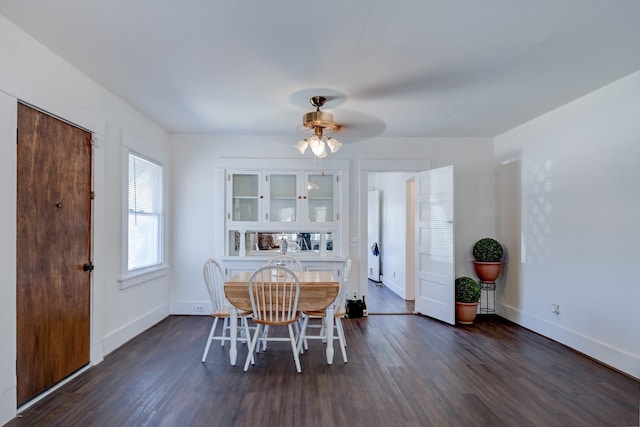 dining room featuring dark hardwood / wood-style floors and ceiling fan