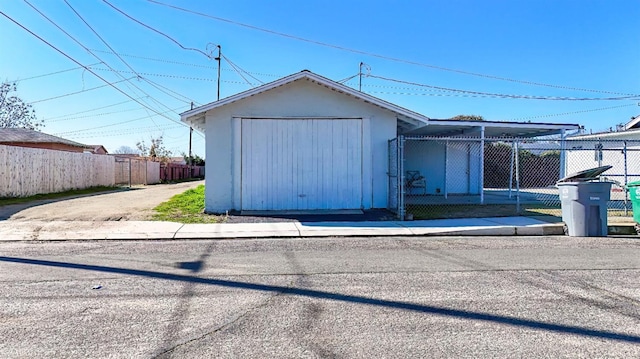 view of front of house featuring an outbuilding