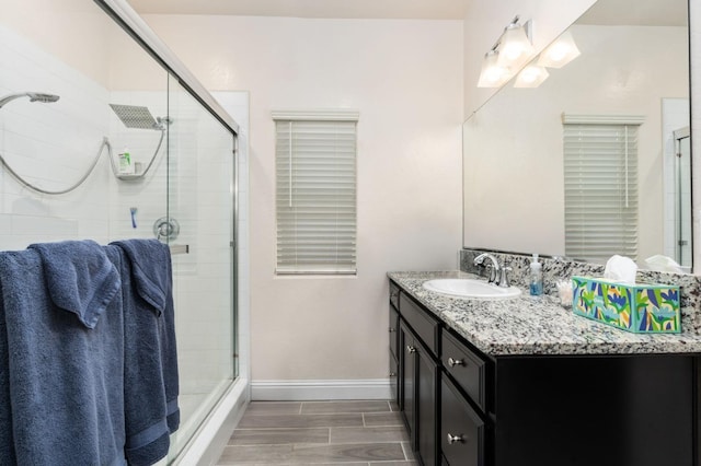 bathroom with vanity and an enclosed shower