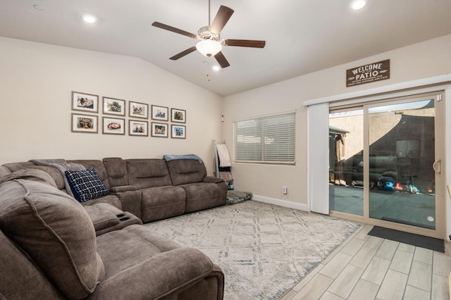 living room featuring ceiling fan and vaulted ceiling